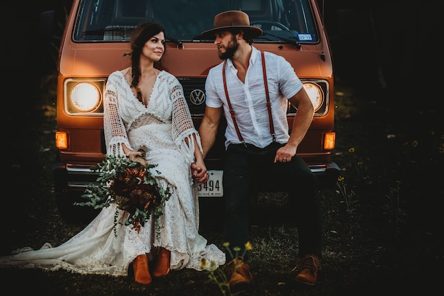 Elopement - Couple Sitting on their Car
